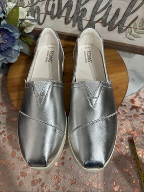 NWOT TOMS Silver Metallic Slip-On Sneakers